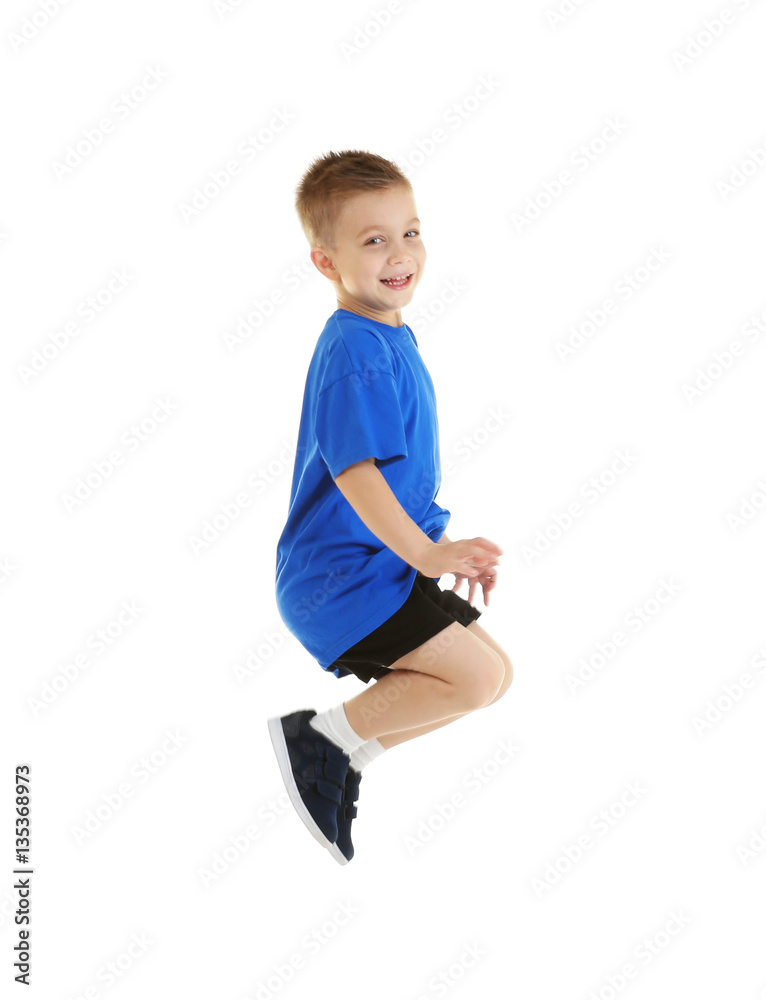 Little sportive boy posing on white background
