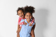 © Africa Studio - Two cute African girls on white background