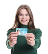 © Africa Studio - Woman with driving license on white background