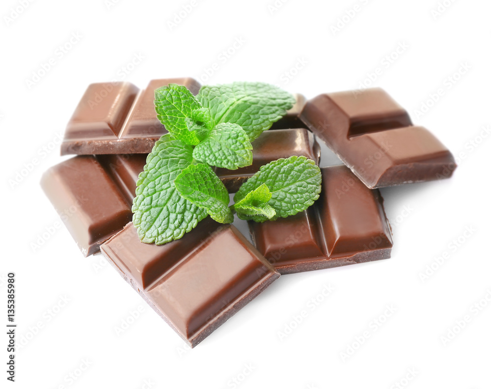 Broken chocolate pieces on white background