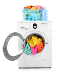 Clothes in washing machine on white background