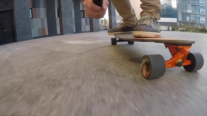 Wall Mural - Closeup of skateboard with man filming while skateboarding