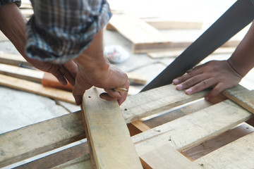 Two carpenter are working together