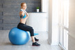 © 4frame group - Beautiful young girl with fit ball at home