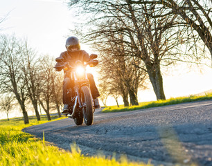 Wall Mural - Motorcycle driver on road