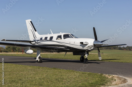 Fotografie, Obraz Private small single turboprop aircraft on airport runway