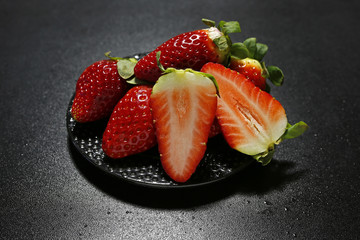 fresh strawberries on black background