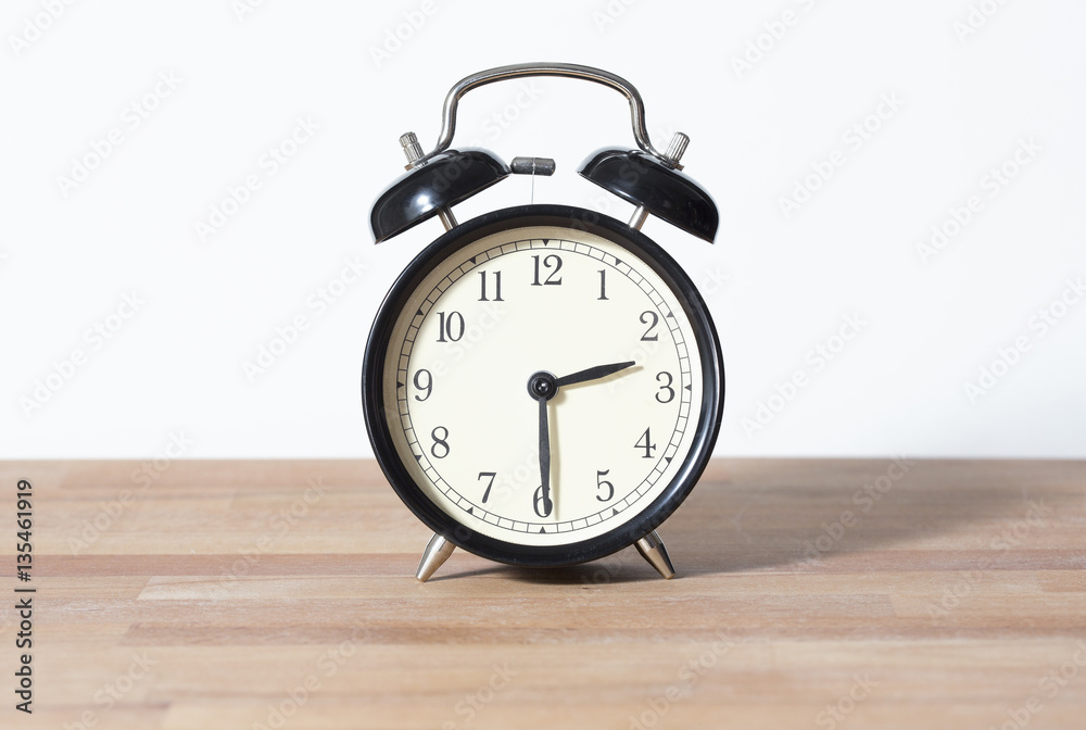 It is half past two o'clock. The time is 2:30. Retro clock isolated on ...