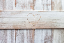 Heart Shaped Carving On A Wooden Fence