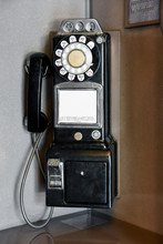 Black Pay Telephone In Phone Booth