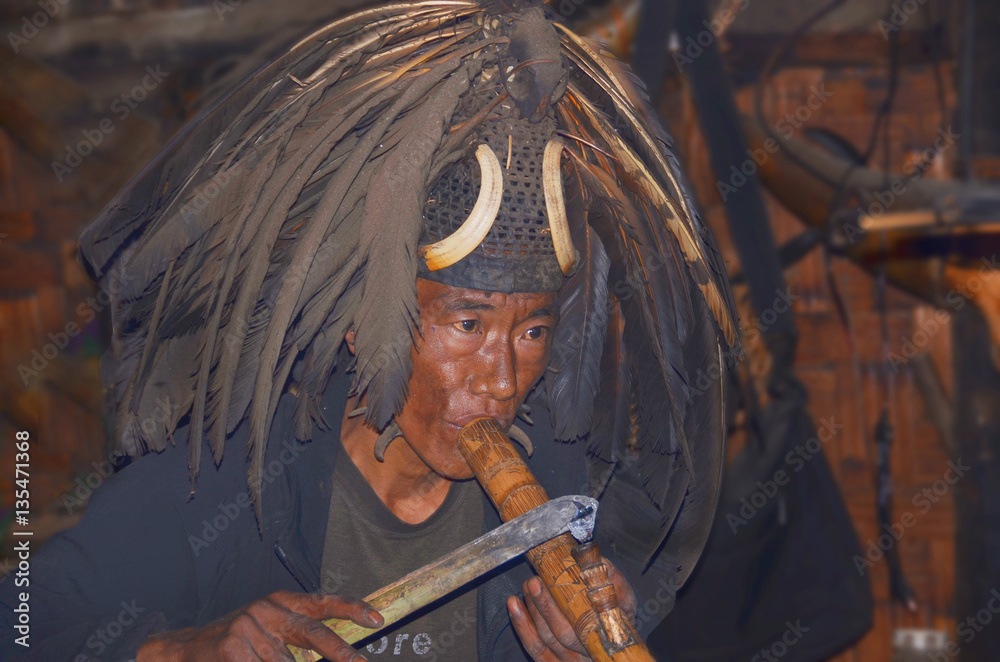 tobacco headhunters Photo Stock Portrait of the warrior from the tribe of Konyak headhunters  smoking tobacco from the pipe which once was used to smoke opium