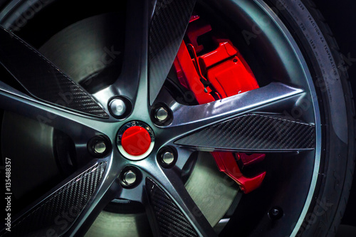 Fotografía Closeup of an beautiful large Alloy wheel of luxury car with painted brake calli