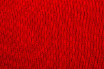 The texture of a knitted woolen fabric red