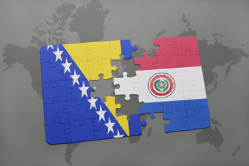 puzzle with the national flag of bosnia and herzegovina and paraguay on a world map