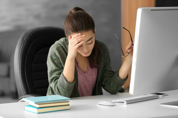 Poster - Tired young woman working in office