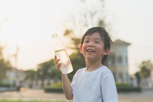 Sian Boy Drinks Water From A Bottle