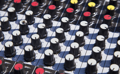 Close up of a music sound mixer at an outdoor event