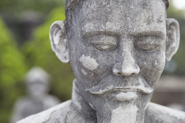 Close up of the face of stone statue, Vietnamese sculptures guarding the tomb of the late Kings