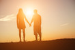 © chaunpis - silhouette of a man and woman holding hands with each other, wa