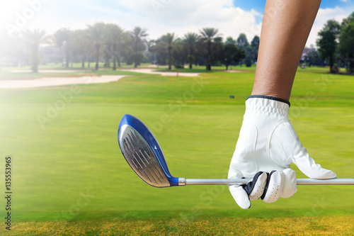 golf-player-holding-a-golf-club-in-golf-course