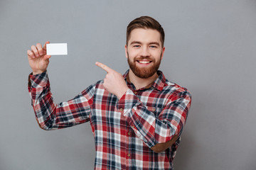 Wall Mural - Handsome bearded man with copyspace business card