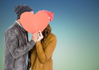 Canvas Print - Romantic couple hiding their face behind heart