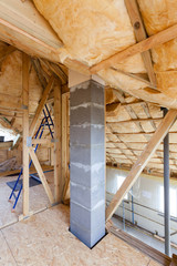 Wall Mural - Iinsulation of attic with fiberglass cold barrier and insulation material