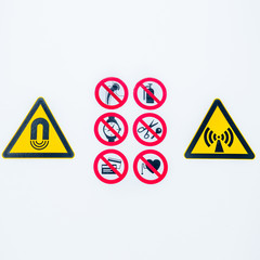 Isolated Warning caution signs at the entrance to the controlled radioactive area lightbox in hospital