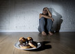 © Wordley Calvo Stock - unhealthy sugar donuts and muffins and tempted young woman or teenager girl sitting on ground