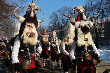 Pernik, Bulgaria - January 28, 2017: Masquerade festival Surva in Pernik, Bulgaria. People with mask called Kukeri dance and perform to scare the evil spirits