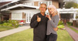 © rocketclips - Happy new senior homeowners smiling at camera