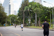 © Anna Issakova - People jogging in Lumpini Park, Bangkok