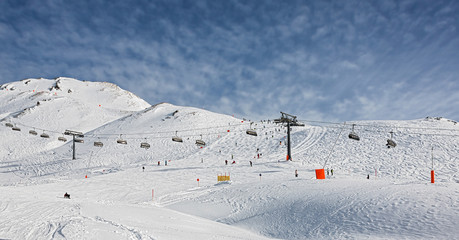 One of chair lifts in a ski resort of a valley of the Zillertal in foggy weather - Mayrhofen, Austria