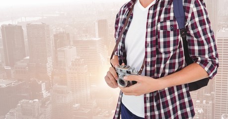 Poster - Mid section of man with backpack and digital camera