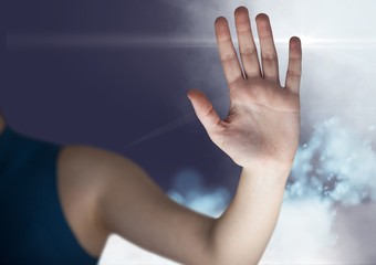 Wall Mural - Womans hand interface screen against sky background