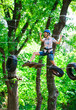 © davit85 - adventure climbing high wire park - people on course in mountain