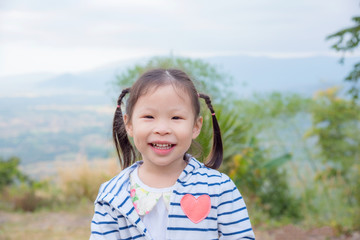 Wall Mural - Little asian girl smiling outdoor