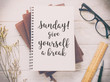 Inspirational motivating quote on notebook with vintage filter