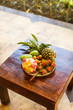 exotic fruits on plate: mango, dragon fruit; mango; pineapple an