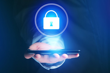 Poster - Businessman hand holding mobile phone with locker icon