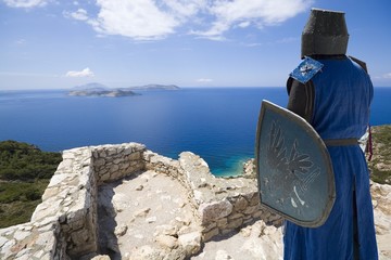 Wall Mural - Medieval knight in ruined castle built by the Knights of Saint John on top of craggy rock in Kritinia, Rhodes, Greece