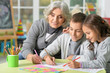 © aletia2011 - Grandmother with kids drawing