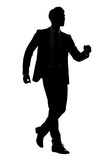 Fototapeta Koty - silhouette of businessman walk