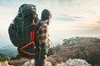 Man Traveler with big backpack hiking mountains expedition Travel Lifestyle success concept adventure active vacations outdoor mountaineering sport