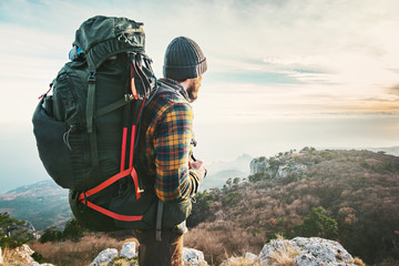 Wall Mural - Man Traveler with big backpack hiking mountains expedition Travel Lifestyle success concept adventure active vacations outdoor mountaineering sport