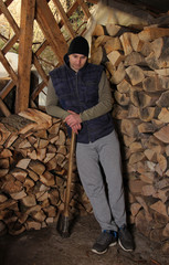 Wall Mural - Man chopping firewood