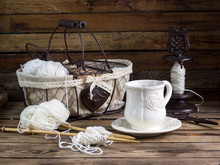 Wool Yarn And Knitting Needles In A Vintage Basket