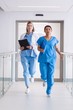 © WavebreakMediaMicro - Nurse and doctor running