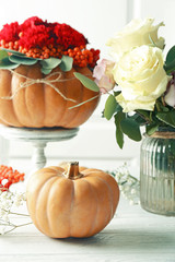 Sticker - Pumpkin and fresh flowers on white wooden table