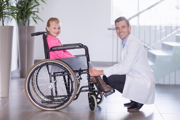 Poster - Portrait of smiling doctor and disable girl